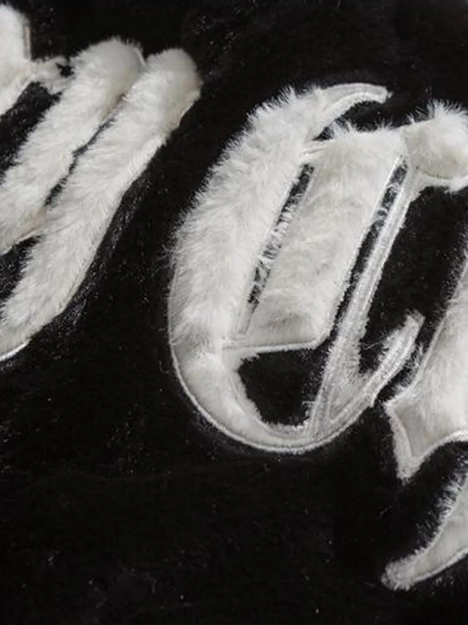 Cozy Energy Fur Coat - Embroidered Design Element